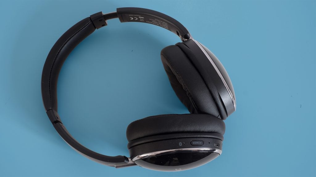 JVC HA-S90BN wireless headphones on blue background