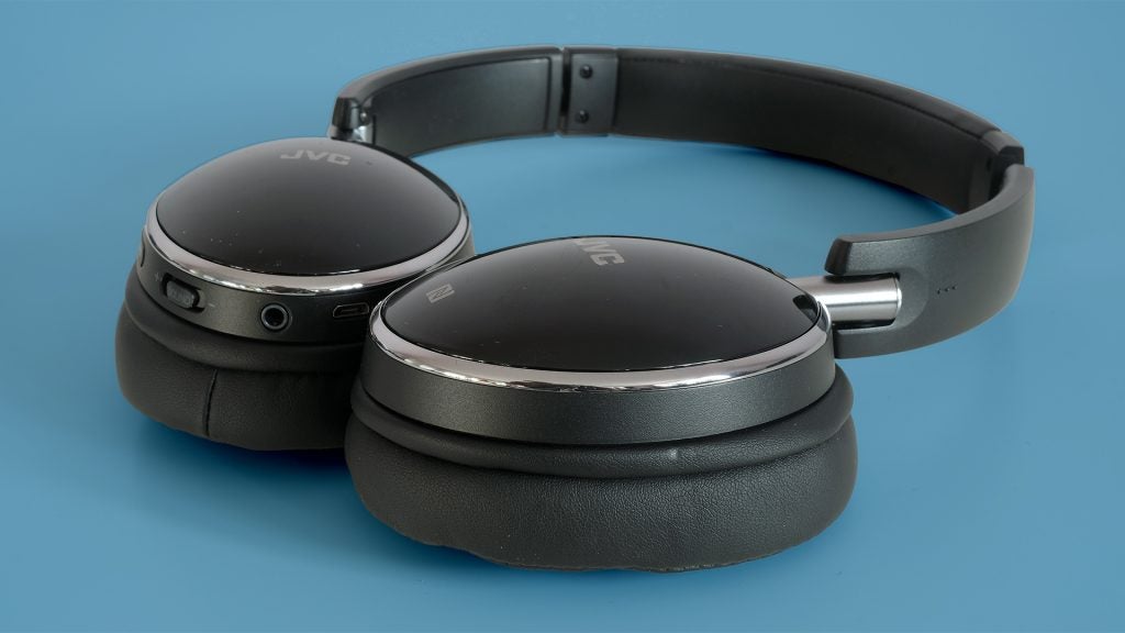 JVC HA-S90BN headphones on a blue background.