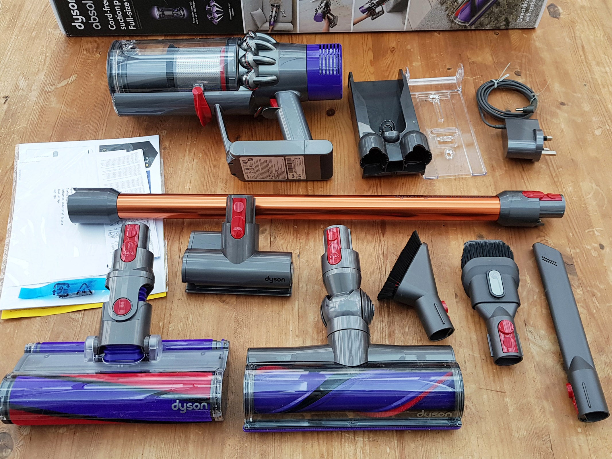Dyson Cyclone V10 Absolute vacuum and accessories displayed.