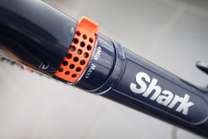 Close-up of Shark DuoClean vacuum wand connection detail.