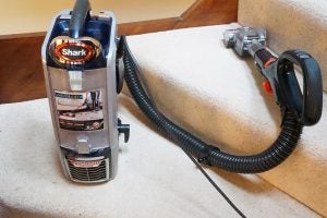 Shark DuoClean Powered Lift-Away Vacuum on carpeted stairs.