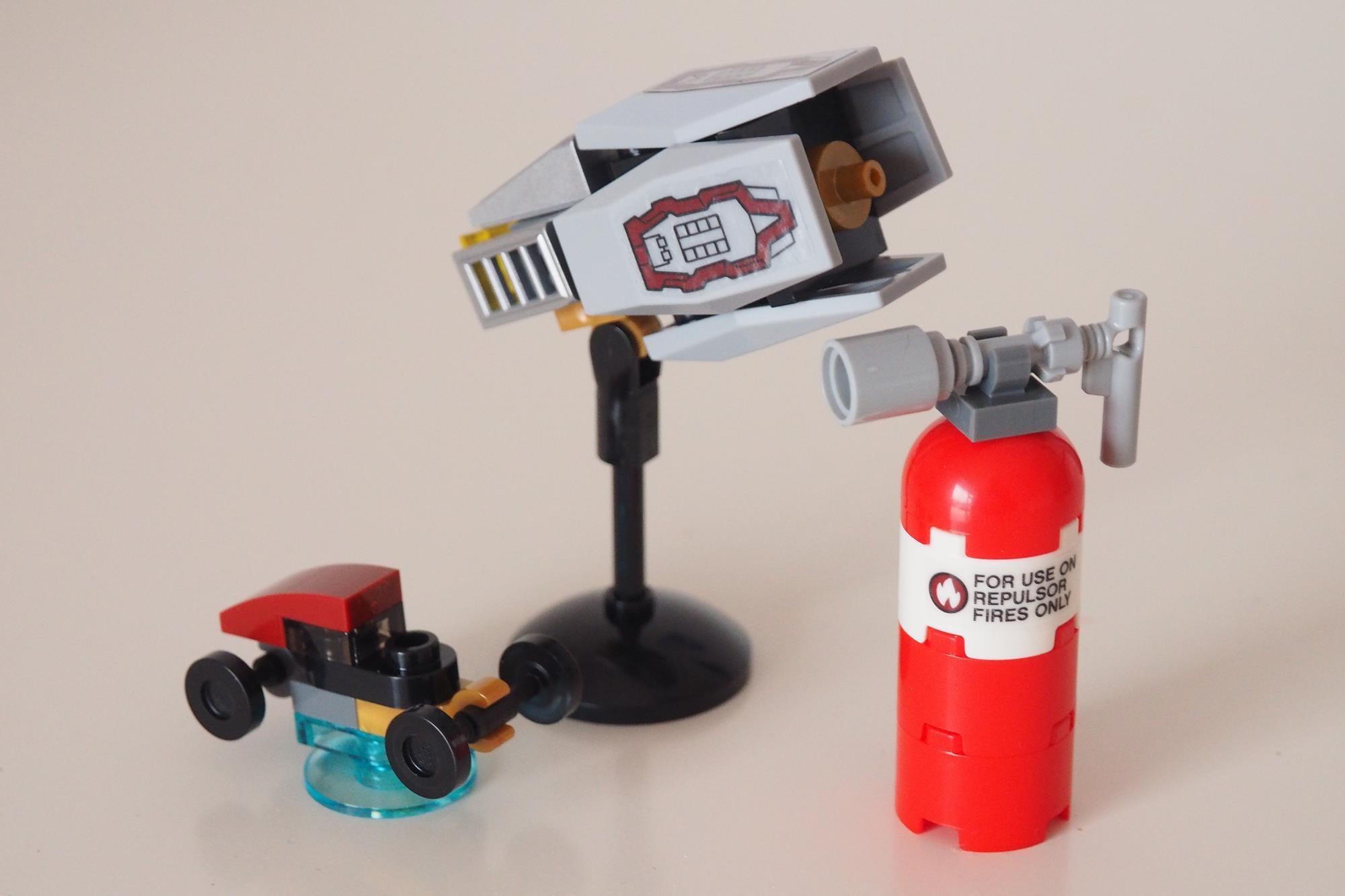 LEGO helmet and fire extinguisher on display.