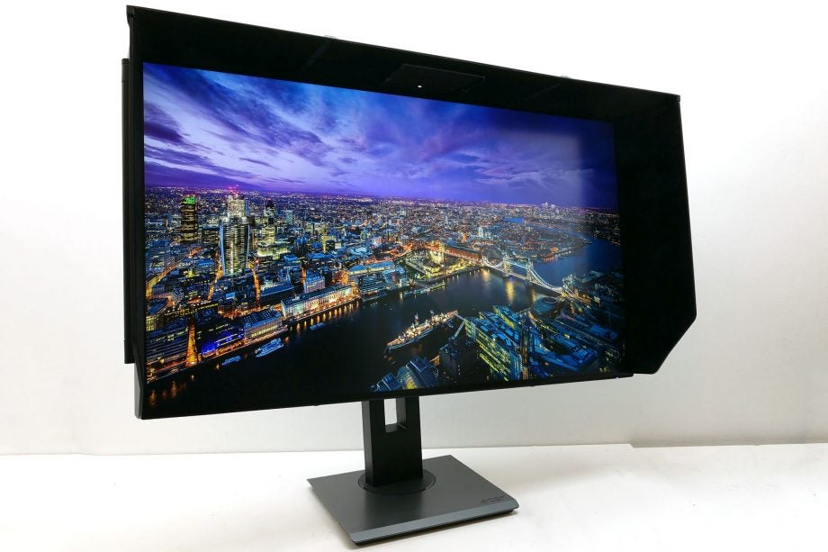 Acer ProDesigner PE320QK monitor displaying vibrant cityscape.