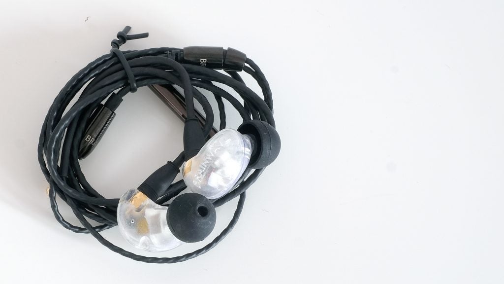 Brainwavz B400 earphones with transparent casing on white background.