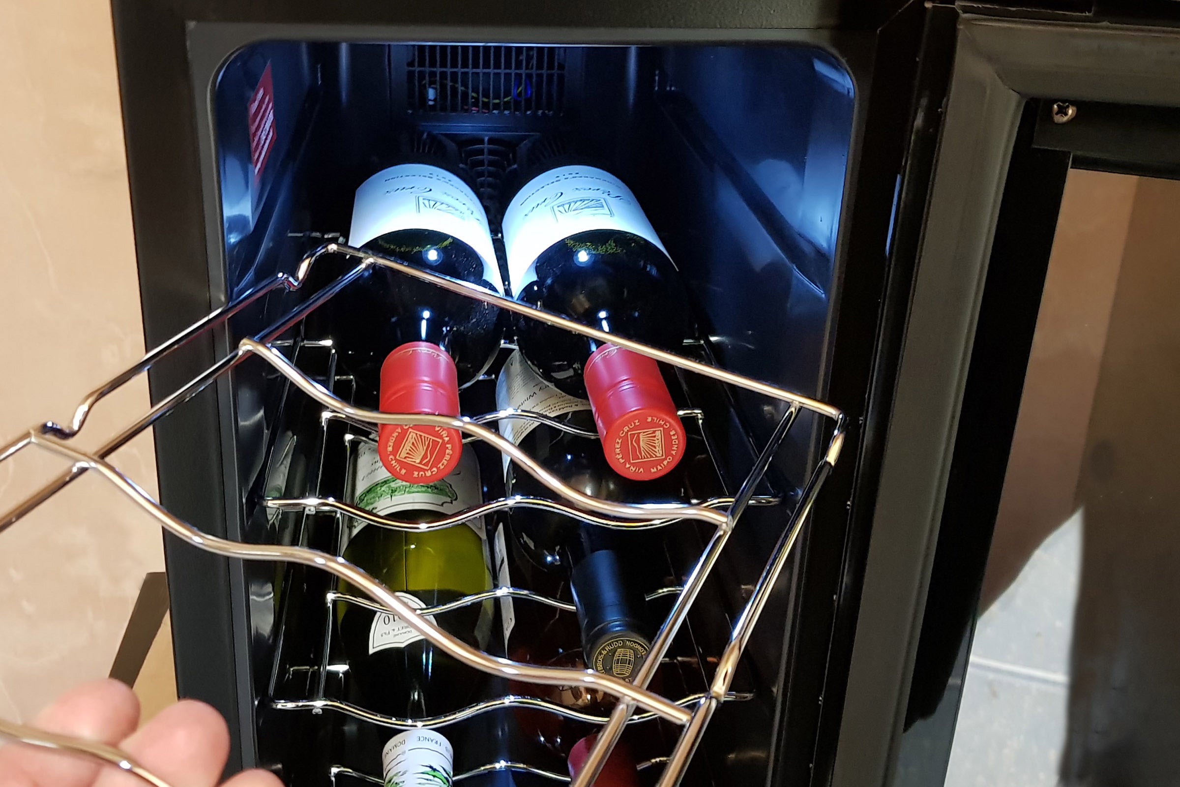 Russell Hobbs RH8WC2 wine cooler with bottles inside.