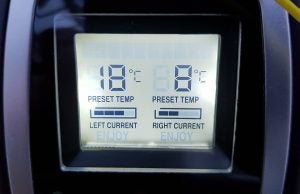Digital display of preset and current temperature settings.