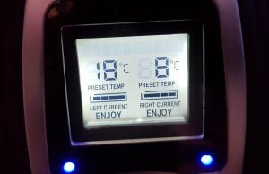 Digital display showing preset and current temperature settings.