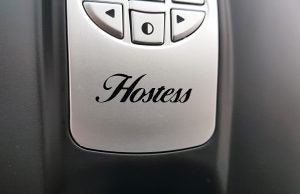 Close-up of Hostess HW02MA product with logo and control buttons.