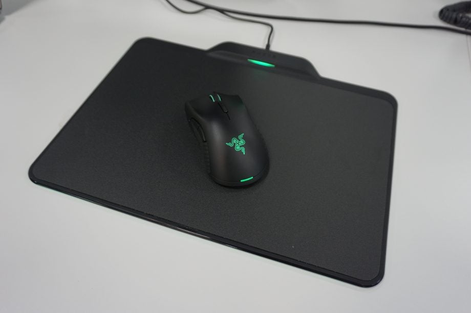 Razer Mamba mouse on Firefly mousepad with green lighting.