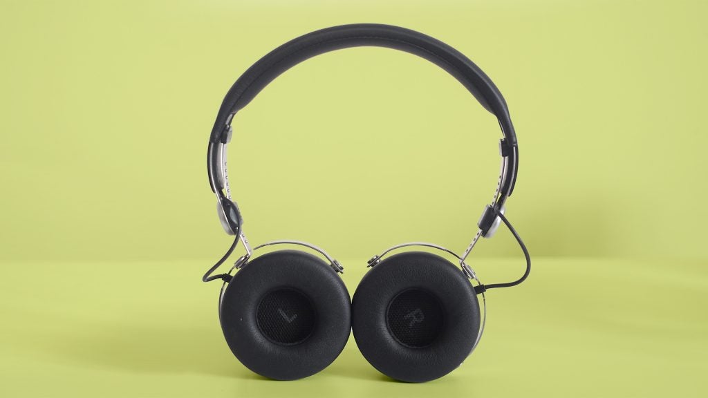 Beyerdynamic Aventho wireless headphones on a green background.