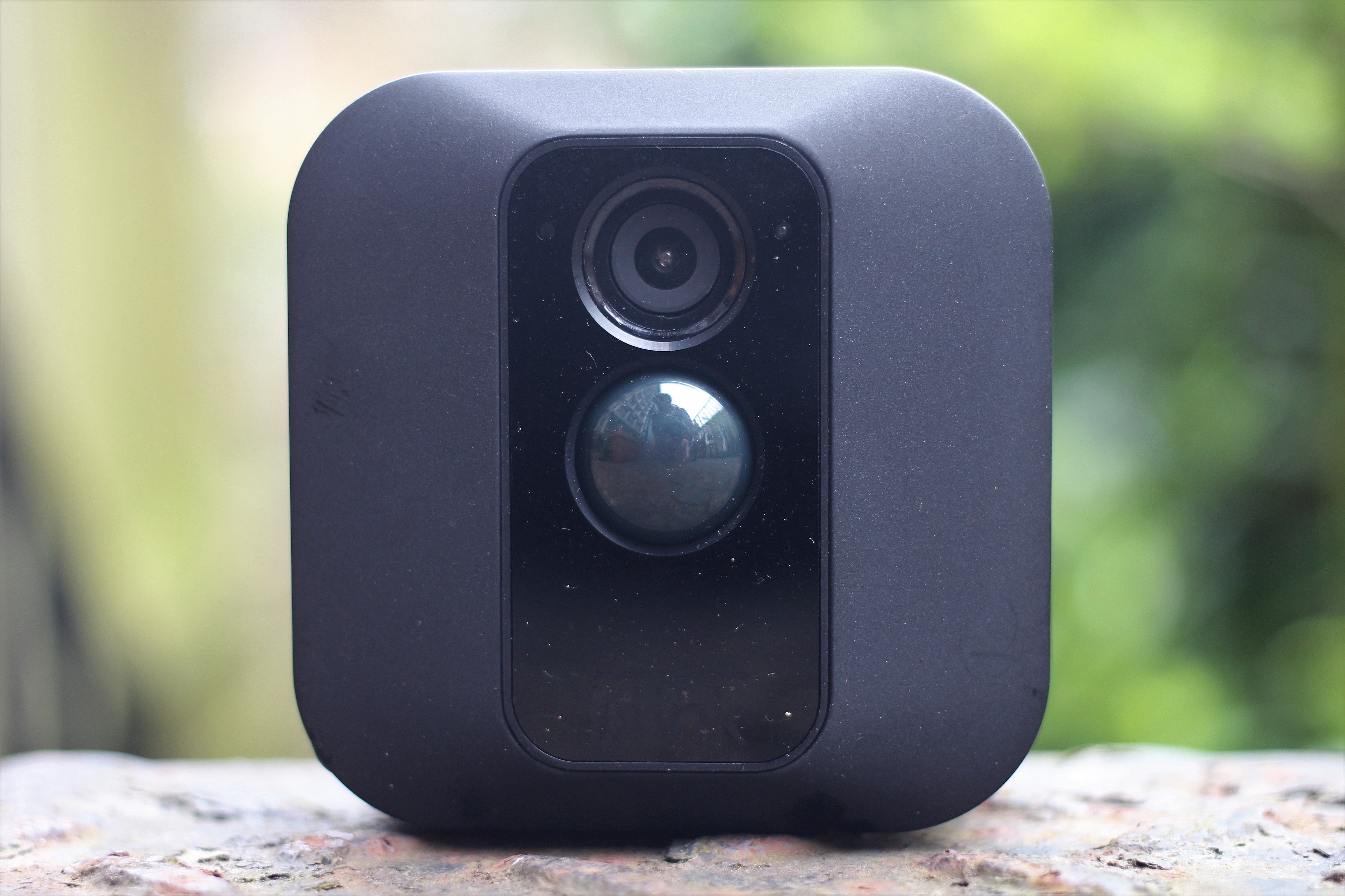 Blink XT outdoor security camera on a natural background.