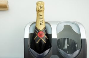 Champagne bottle in a wine cooler appliance.