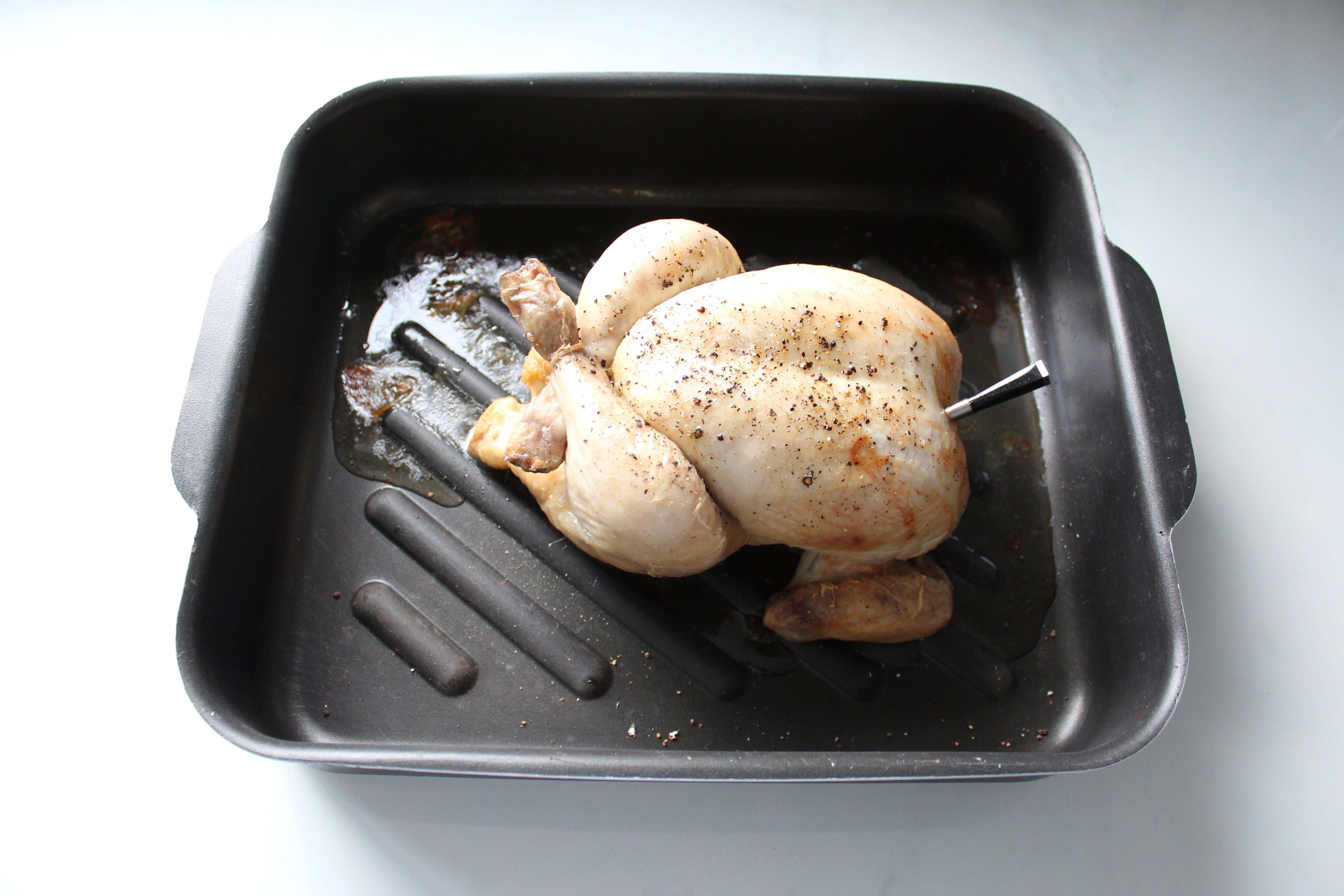 Roast chicken with Meater Probe Wireless Thermometer inserted.