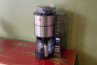 Melitta AromaFresh Grind and Brew coffee maker on table.