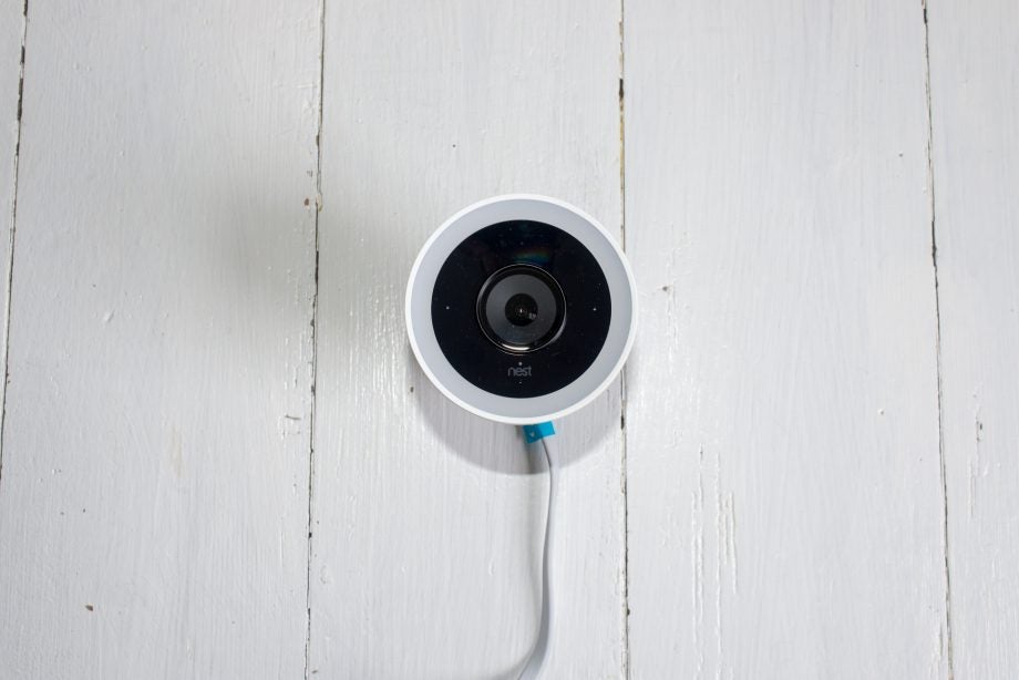 Nest Cam IQ Outdoor mounted on a white wooden wall.