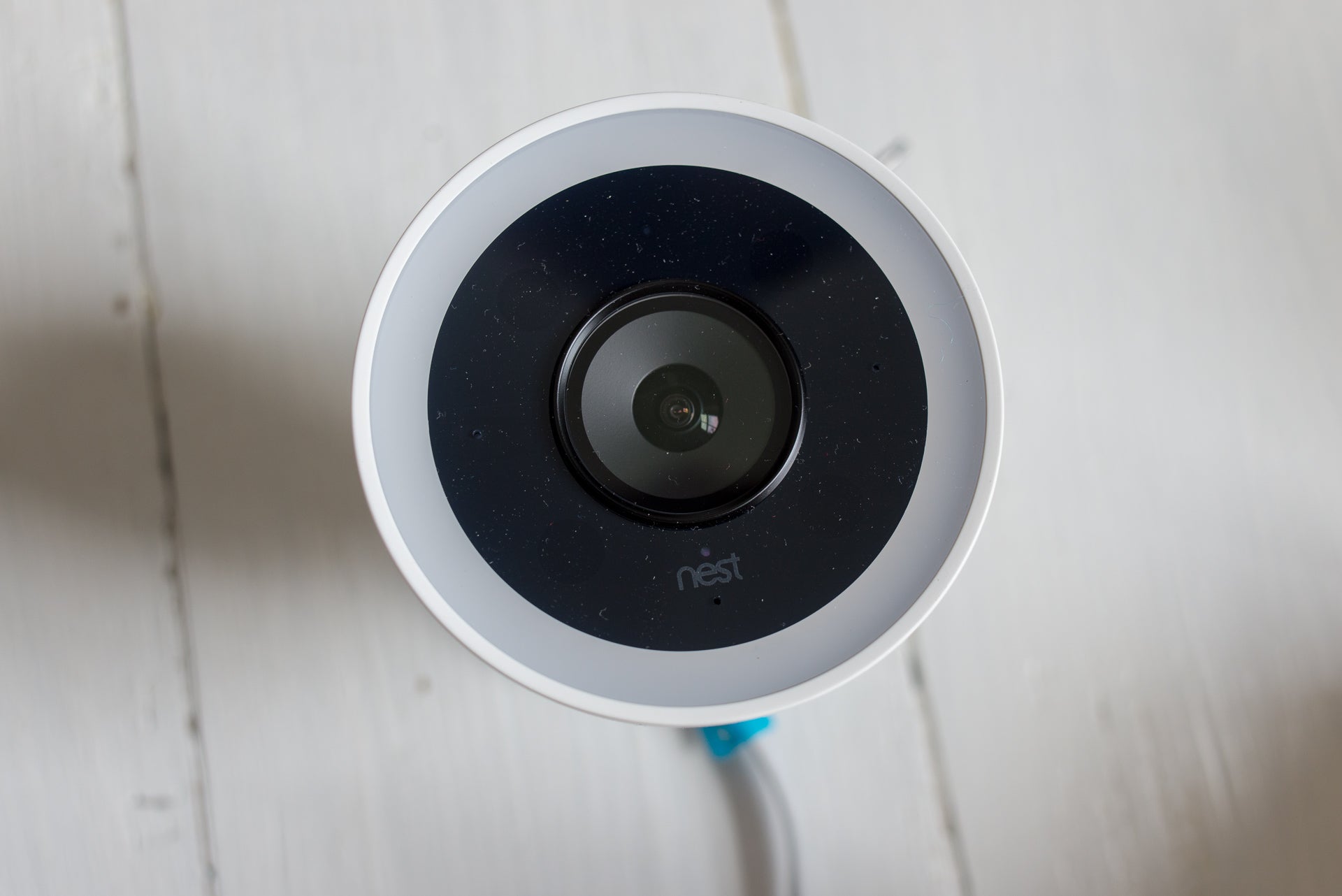 Nest Cam IQ Outdoor security camera on white surface.