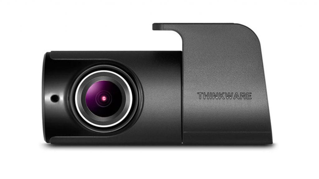 Thinkware F100 dashcam with visible lens and branding.
