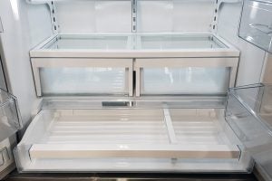 Bertazzoni REF90X refrigerator interior empty shelves and drawers.