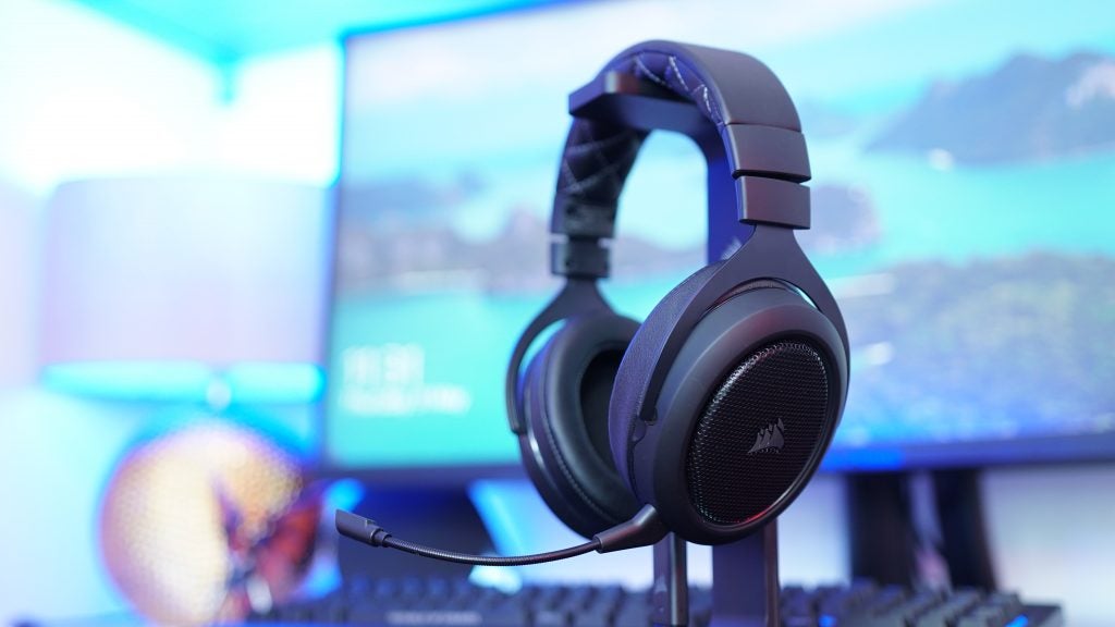 Corsair HS70 wireless gaming headset on a desk with PC background