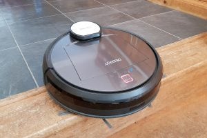 Ecovacs Deebot R95 robotic vacuum cleaner on a tiled floor.