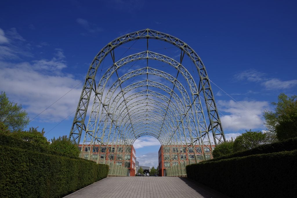 Clear sky through a large metal arch photographed with Pentax K-1 II.