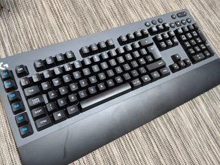 Logitech G613 wireless mechanical keyboard on textured surface