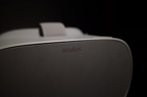 Close-up of Oculus Go VR headset against a black background.
