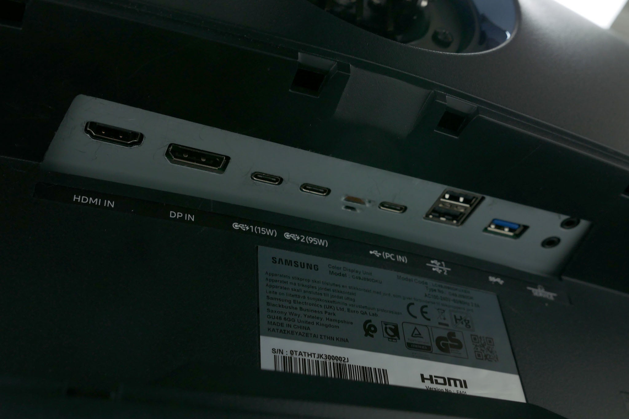 Samsung C49J89 monitor's ports and product label close-up.