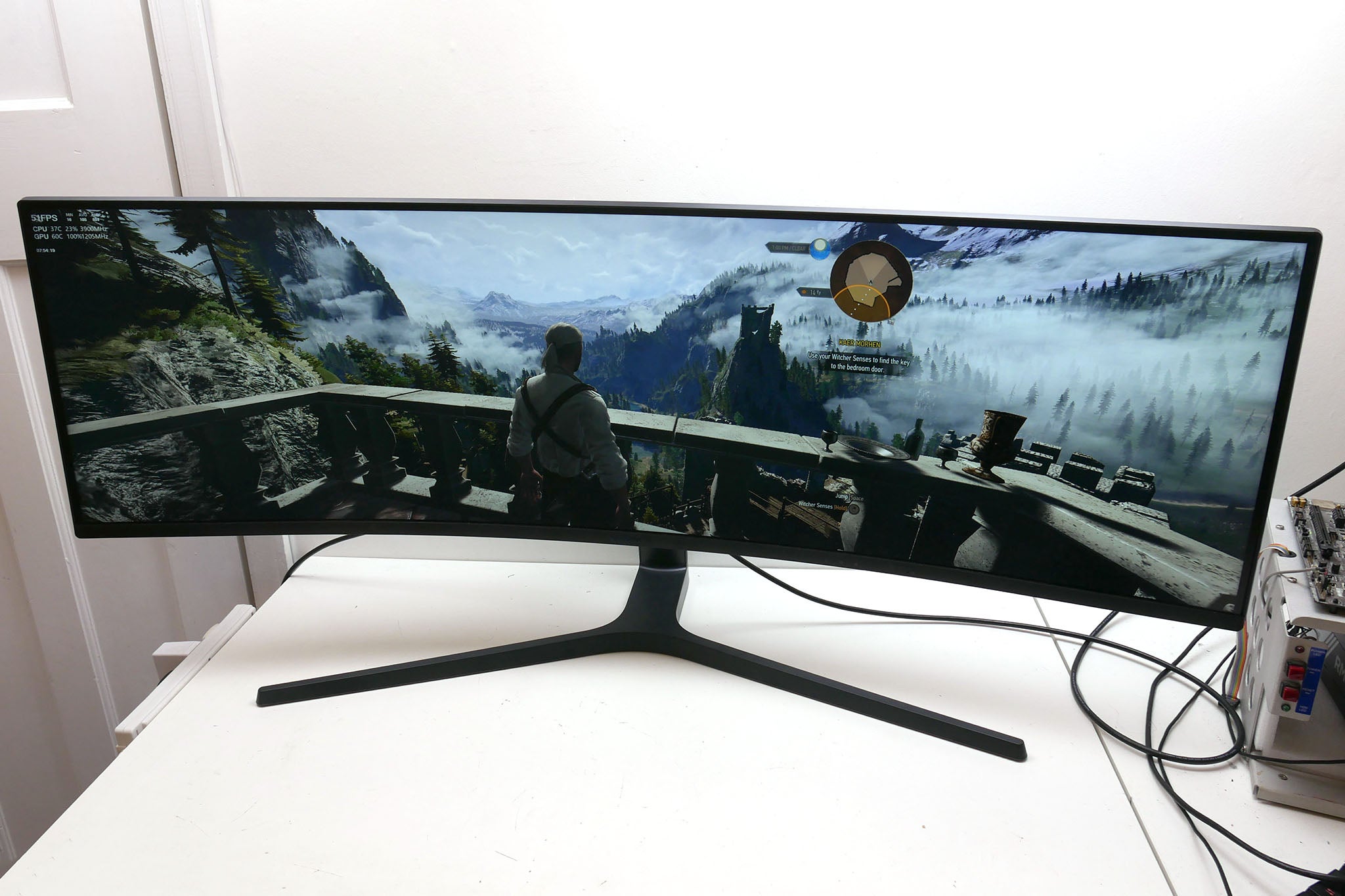 Samsung C49J89 monitor displaying a video game scene.