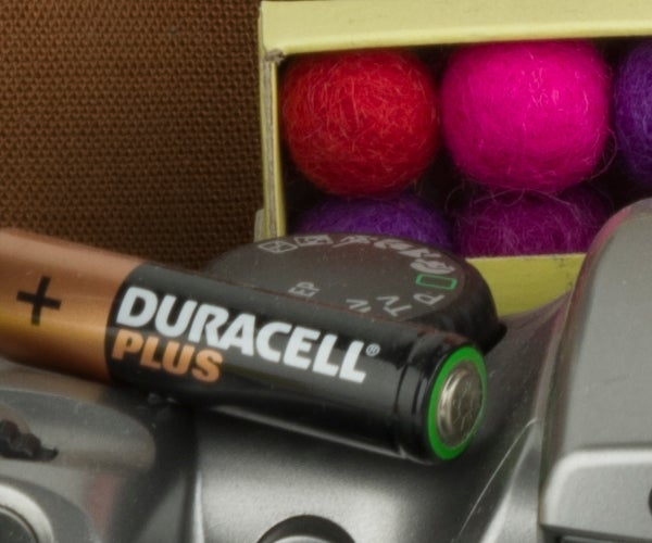 Close-up of Duracell battery and colorful balls