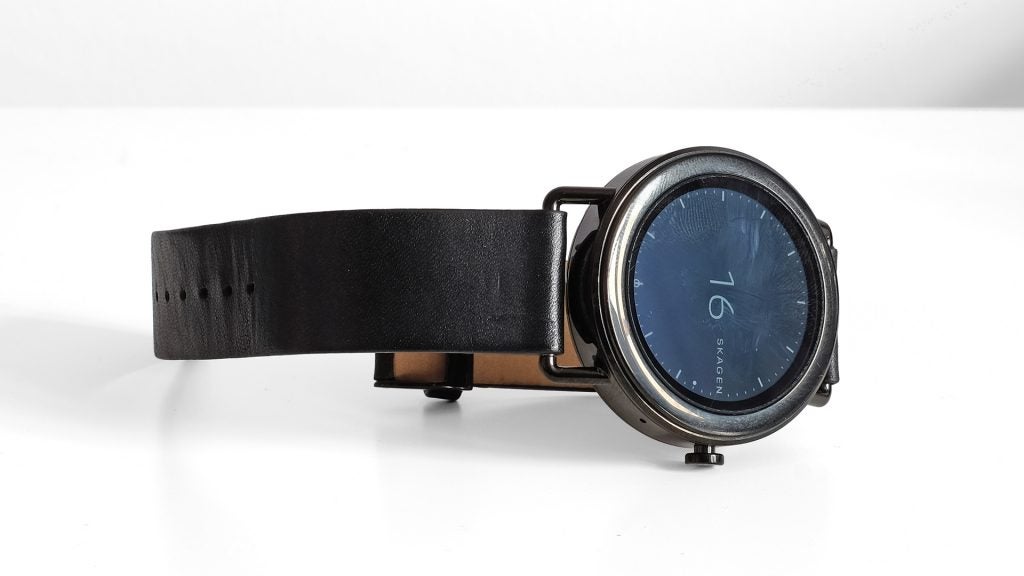 Skagen Falster smartwatch with black leather strap on white background.