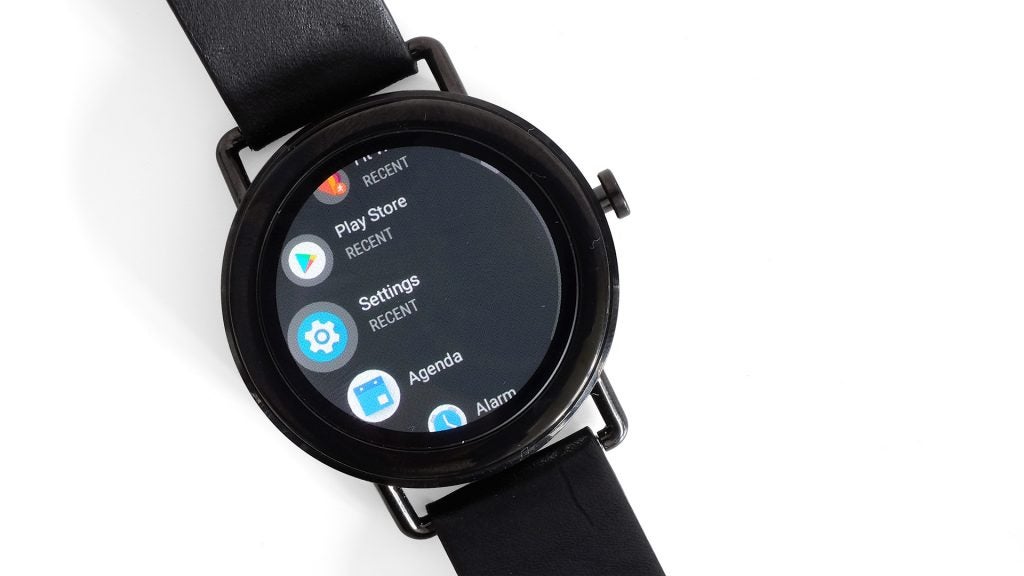 Skagen Falster smartwatch displaying apps menu on white background.