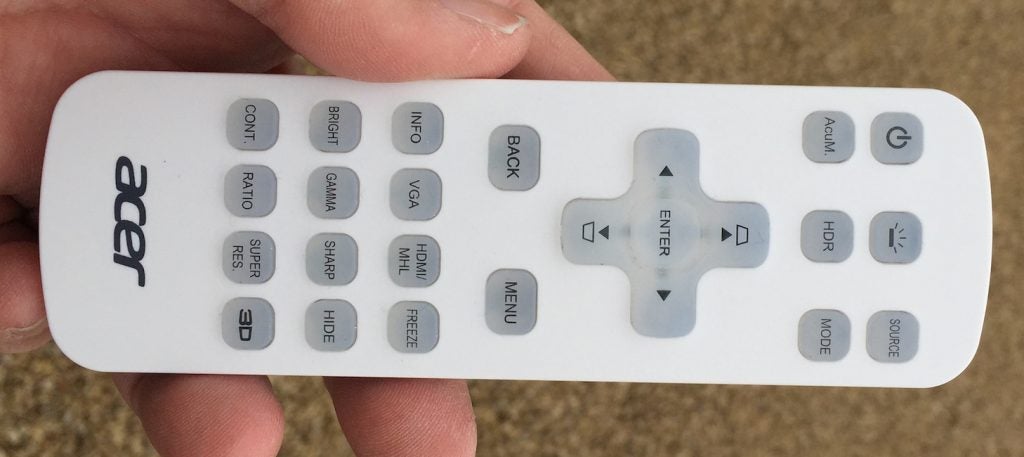Acer V6810 projector remote control in hand.