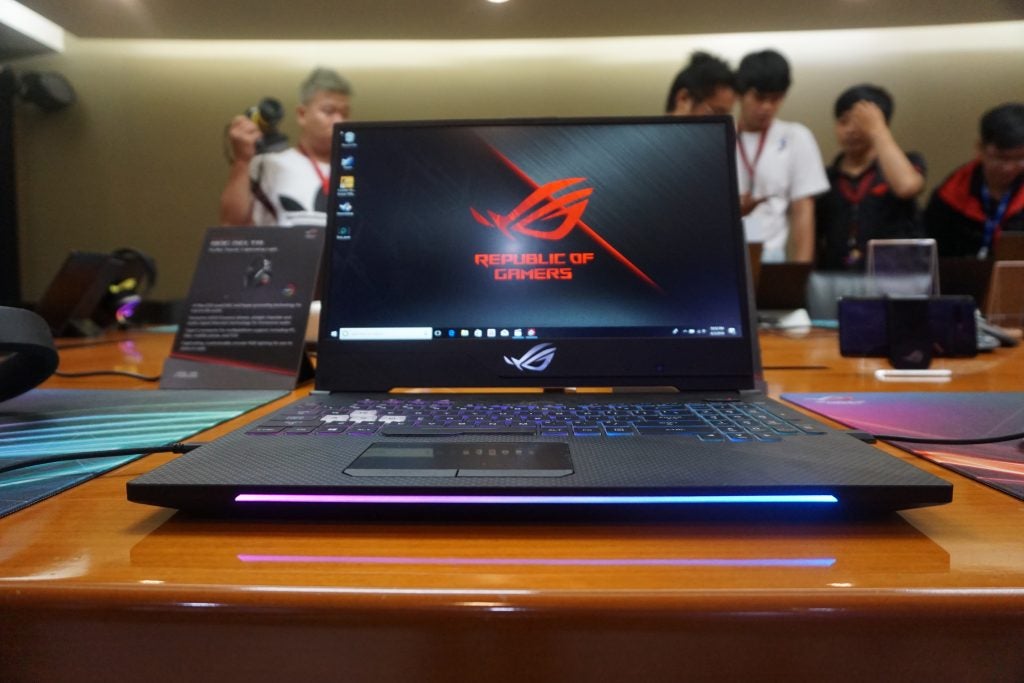 Asus ROG Strix Scar laptop on a table with RGB lighting