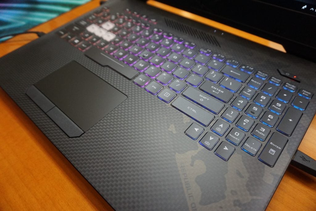 Asus ROG Strix Scar II laptop keyboard with RGB lighting.