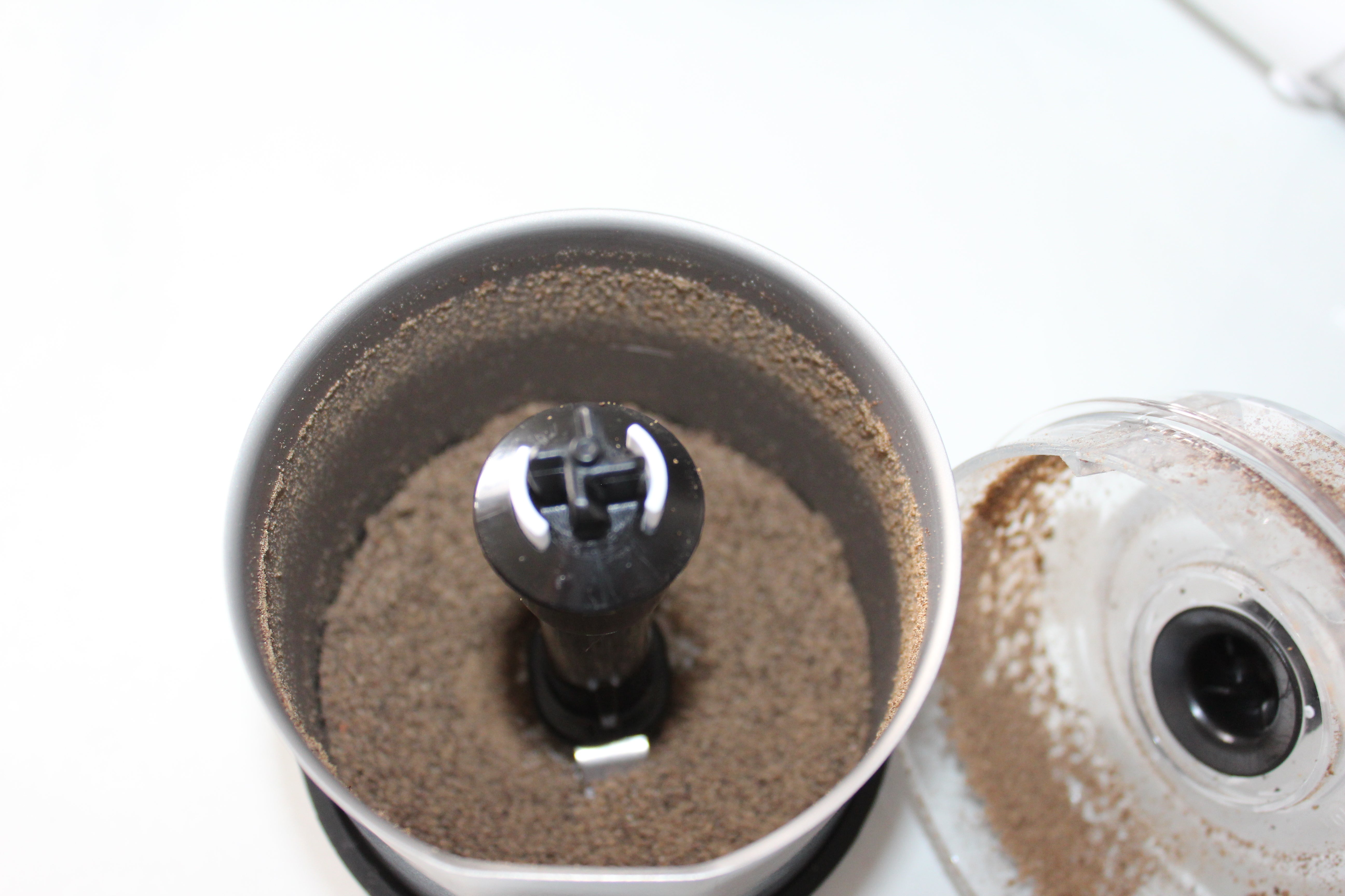 Braun MultiQuick Spice grinder with ground spices inside.