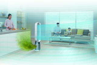 Dyson Pure Cool purifier visualizing airflow in a room with family.