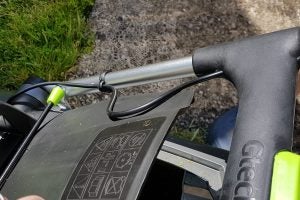 Close-up of Gtech Falcon Cordless Lawnmower controls and handle
