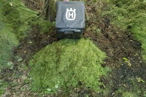 Husqvarna LC 347VLi lawnmower on freshly cut grass.