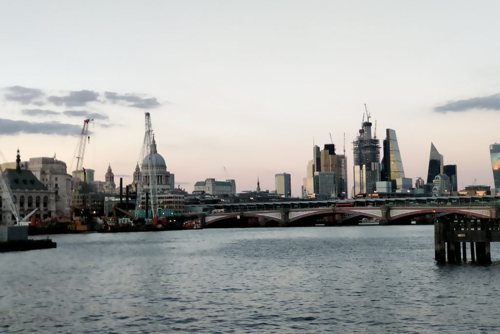 London skyline at dusk with Thames River and bridges