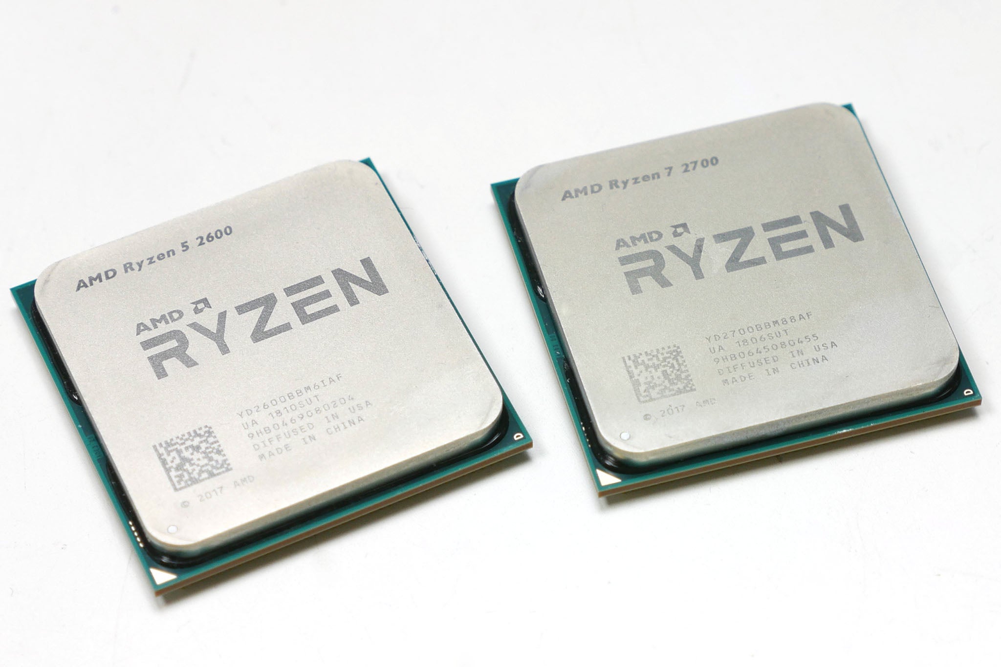 AMD Ryzen 7 2700 and Ryzen 5 2600 CPUs side by side.