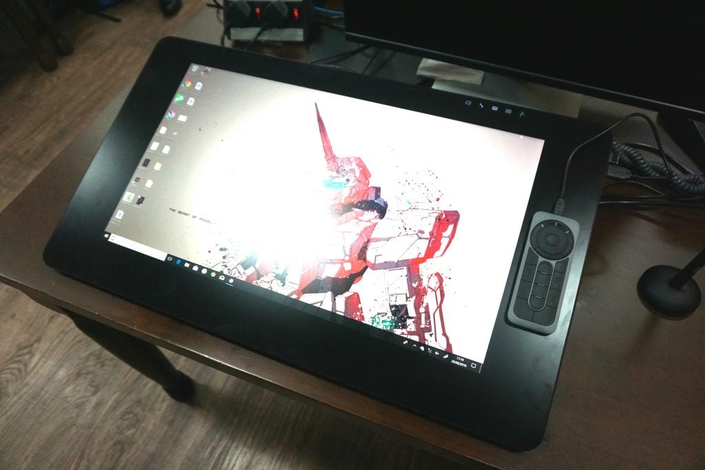Wacom Cintiq Pro 24 graphic tablet with stylus and remote.