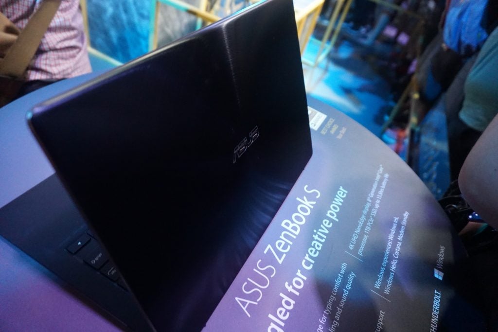 Asus Zenbook laptop with promotional text on screen
