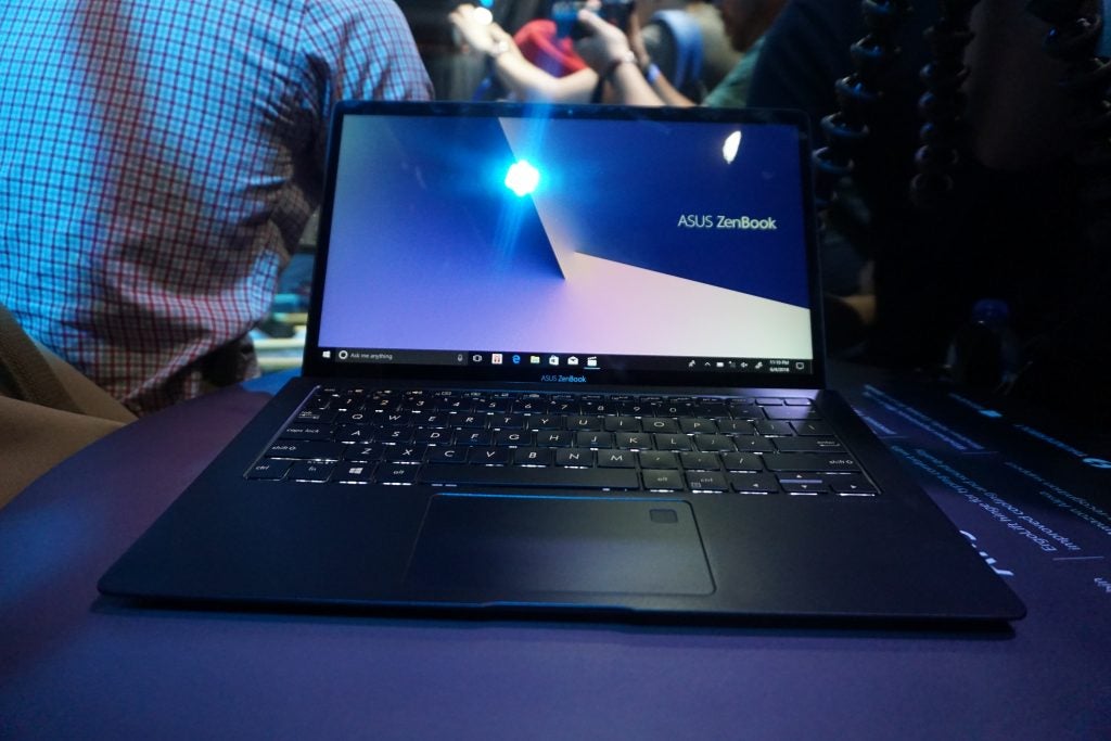 Asus ZenBook laptop on display with screen visible.