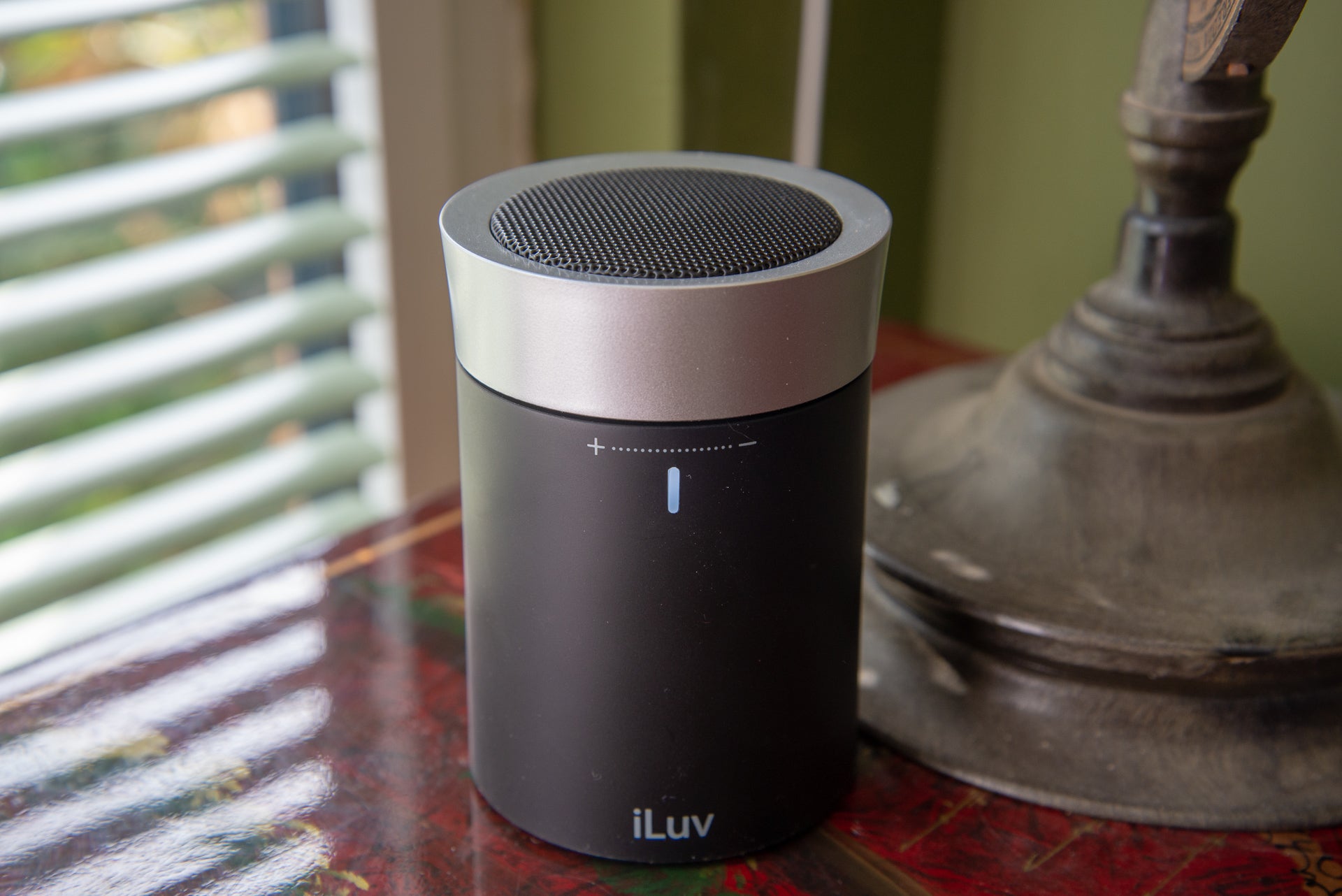 iLuv Aud Click portable speaker on a table.