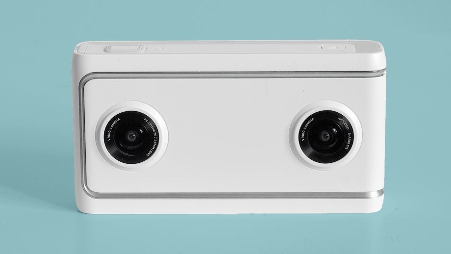 Lenovo Mirage Camera with dual lenses on turquoise background.