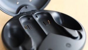 Close up inside view of Sony Xperia Ear Duo earbud's black case kept on table
