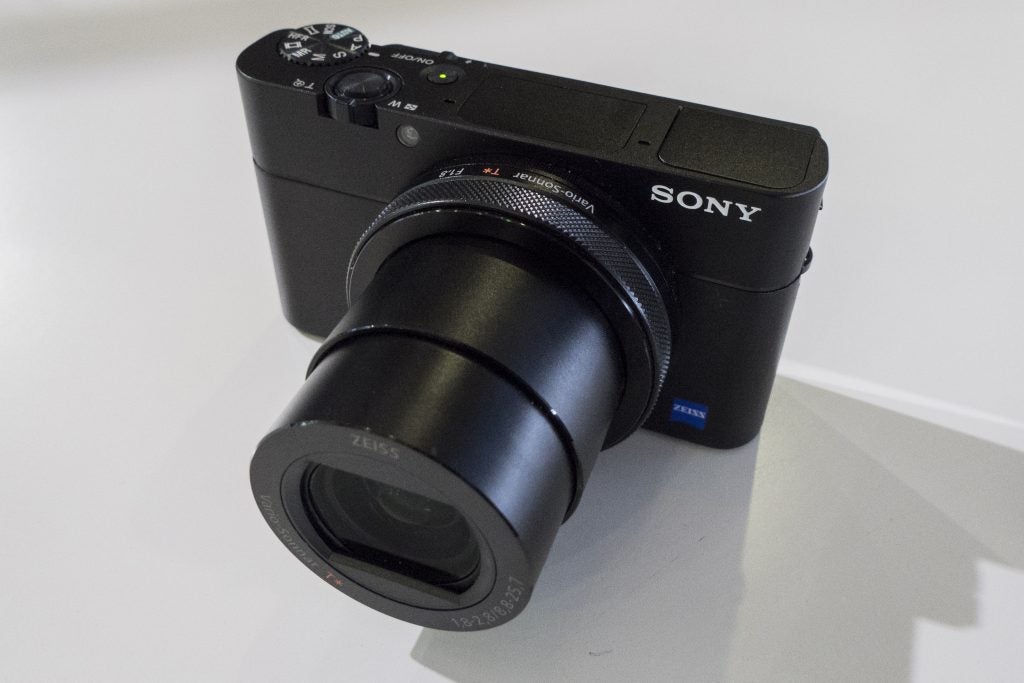 Sony RX100 VTop right angled view of a black Sony RX100 camera standing on white background