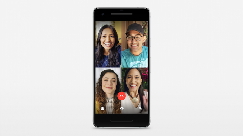 A black smartphone standing on white background displaying Whatsapp video calls