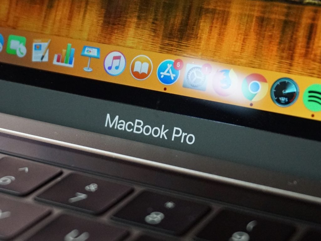 A close up of the 2018 MacBook Pro's logo, keyboard and a portion of the display.